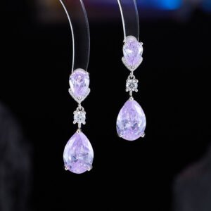 Teardrop crystal drop earrings wholesale featuring champagne yellow and lavender purple pear-cut cubic zirconia gems with micro-pave accents on 18k gold and palladium plated brass.