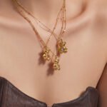 18K gold plated 316L stainless steel 3D teddy bear pendant necklace with heart cut cubic zirconia center wholesale