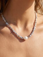 Gold and silver plated chunky irregular pebble bead strand necklace with a center pearl in ore material metal