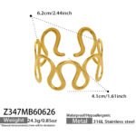 Gold and silver 316L stainless steel open cuff bangles featuring embossed Elizabeth coin medallions and a sculptural wavy cutout design