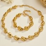 Gold and silver plated chunky irregular molten metal and baroque pearl statement necklace and bracelet set in stainless steel