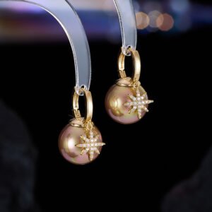 Starburst pearl hoop earrings wholesale featuring high luster champagne gold, peacock black, and classic golden shell pearls with pavé cubic zirconia North Star charm on 18k gold and palladium plated brass.