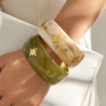 Gold plated starburst inlaid wide resin bangle bracelet in 316L stainless steel