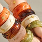 Gold plated starburst inlaid wide resin bangle bracelet in 316L stainless steel
