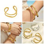Gold and silver plated 316L stainless steel open cuff bangle with a fluid double-line wavy organic design