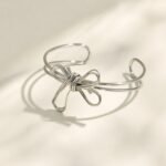 Gold and silver multi-strand wire bow knot open cuff bangle bracelet in polished 316L stainless steel